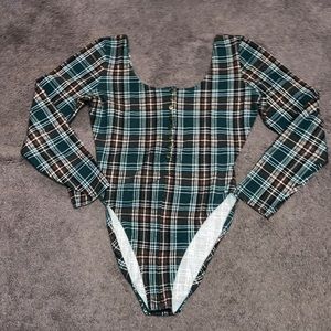 A plaid long sleeve bodysuit...NWOT